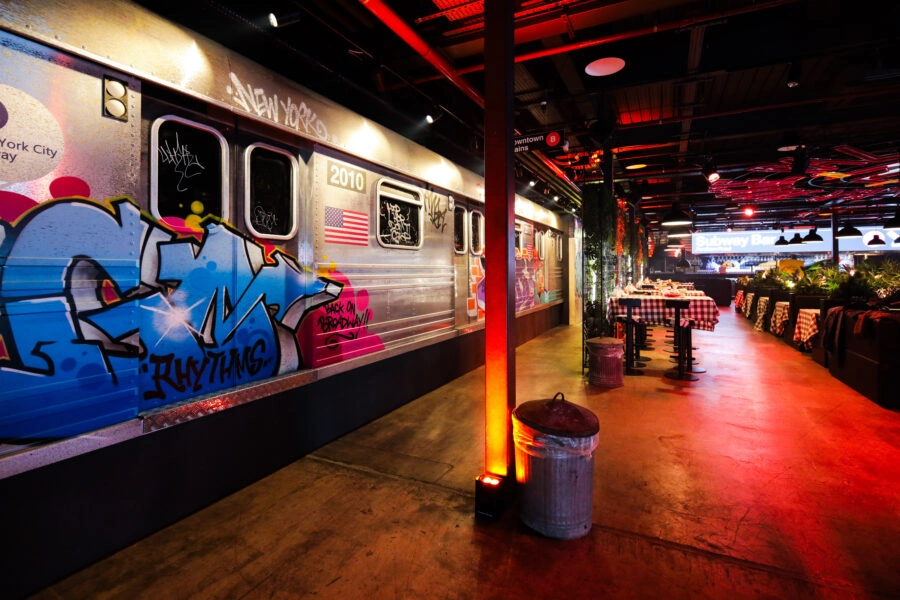 A graffiti-covered subway carriage at the private party