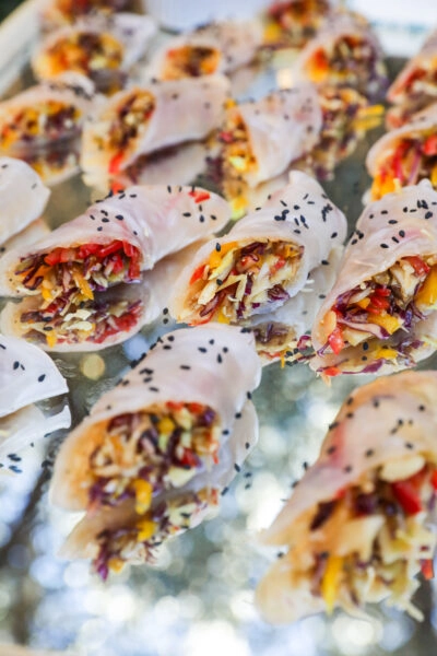 Rice paper canapé rolls filled with vegetables and topped with sesame seeds